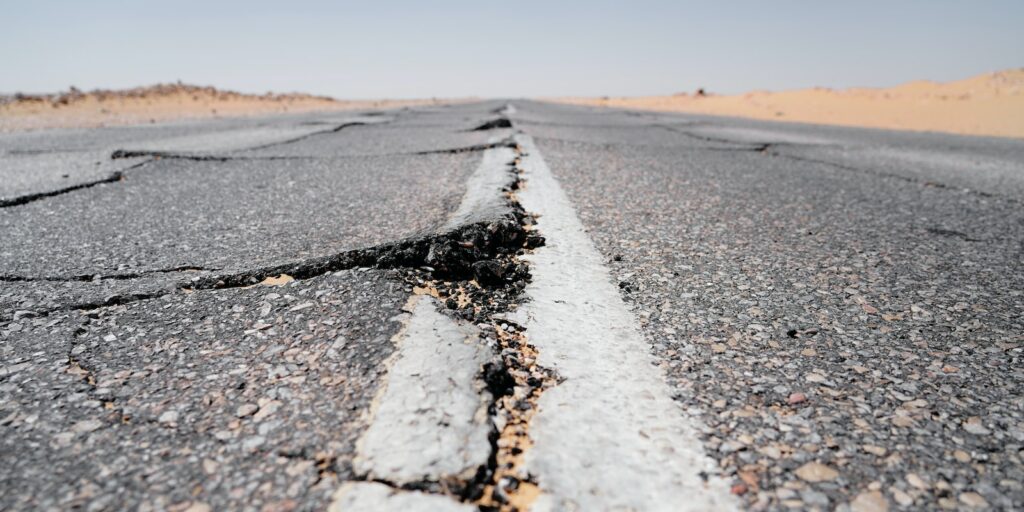 a crack in the middle of a road in the middle of nowhere