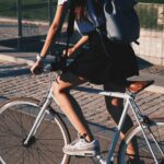woman riding white rigid bike